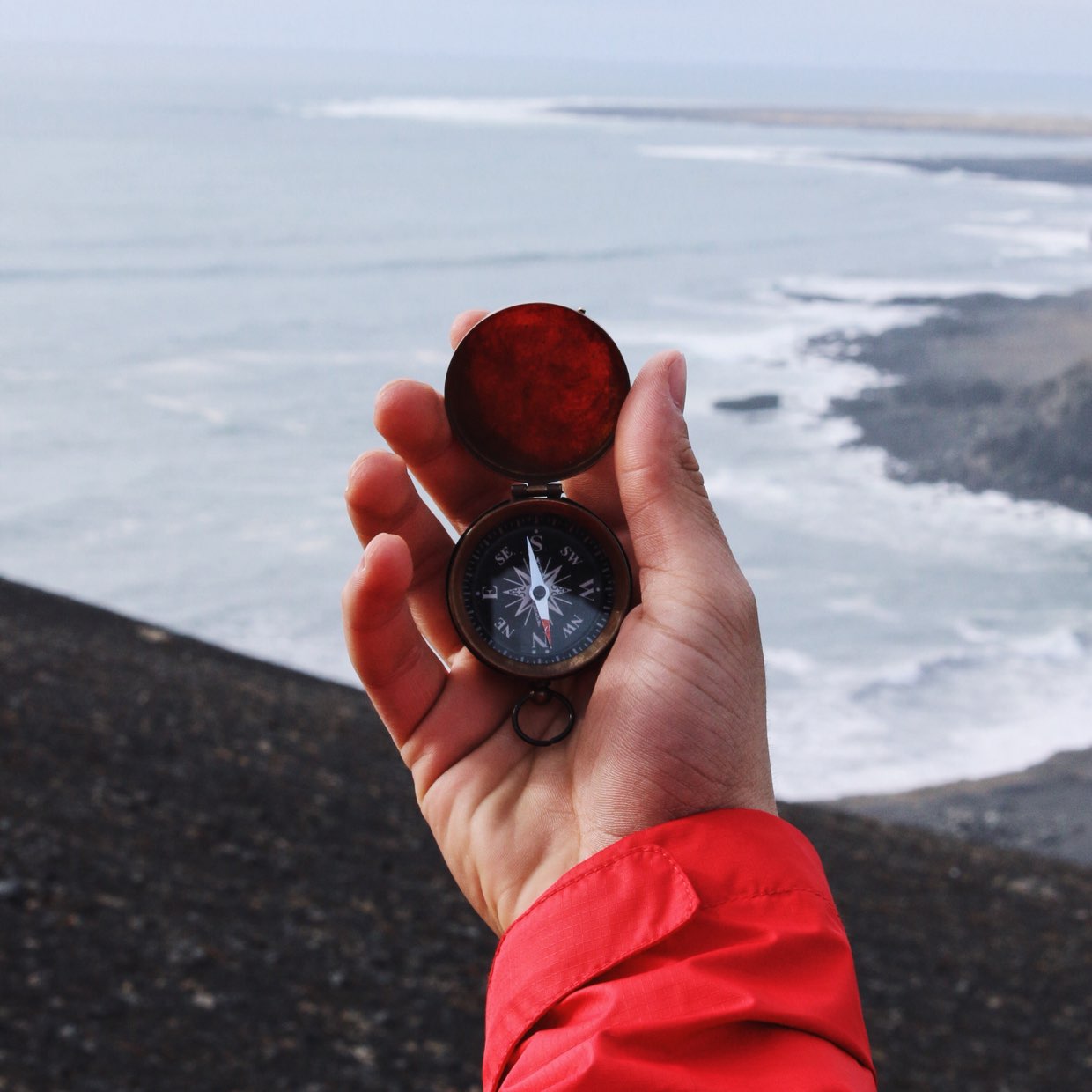 Hand holding a compass (Garrett Sears, Unsplash)